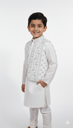 Front view of boys ethnic wear set white kurta with silver detailed vest