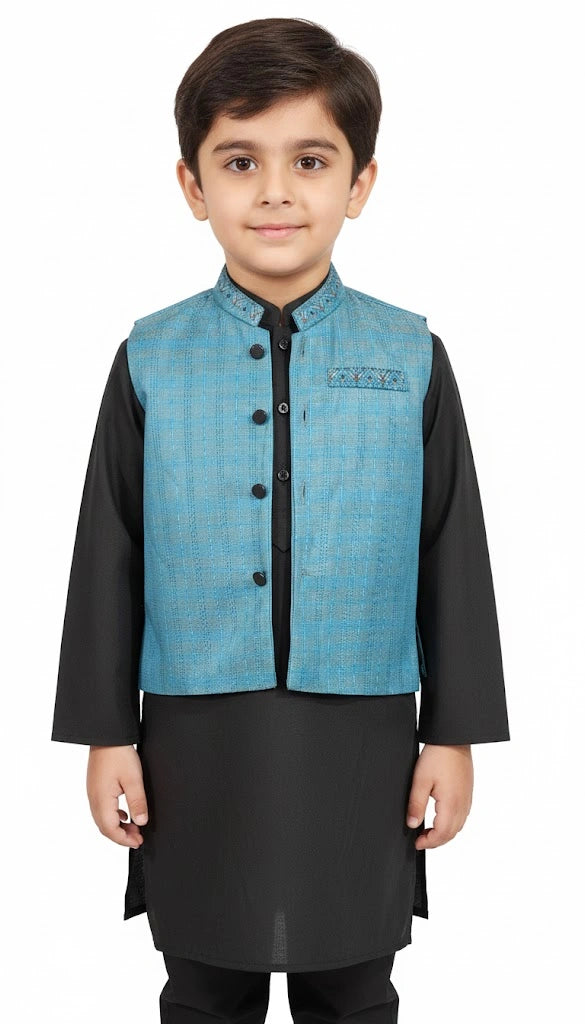 Child wearing a blue vest over a black kurta on 