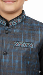 Little boy wearing a brown and blue checkered waistcoat over a black kurta shalwar - Kids Traditional Party Wear