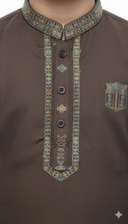 Close up of embroidery design on boys kurta collar and placket.