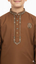 Close up of embroidery design on boys kurta collar and placket.