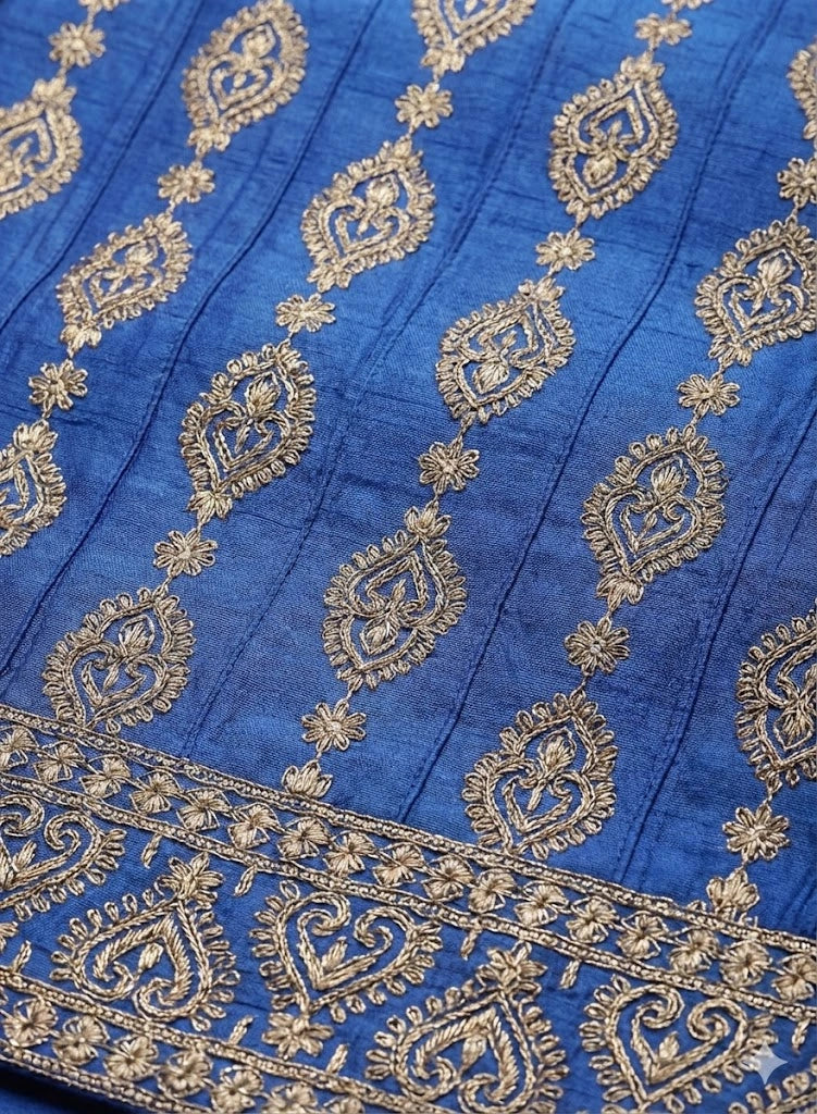 Detail of zari embroidery and sequins on boys festive waistcoat.