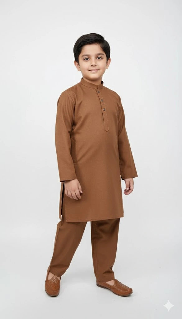 Little boy wearing Rust Brown Kurta Shalwar standing pose.